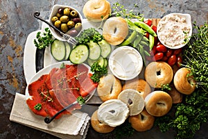 Big breakfast platter with bagels, smoked salmon and vegetables