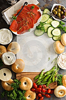 Big breakfast platter with bagels, smoked salmon and vegetables