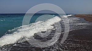 Big breaking ocean or sea wave on a beach