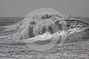 Big breaking wave in a stormy day