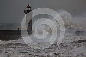 Big breaking waves over lighthouse