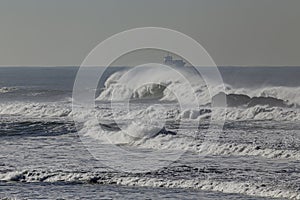 Big breaking white sea waves in the coast