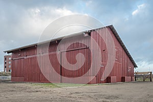 Big bright red wooden barn