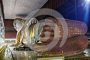 Big buddha Kyauk Htat Gyi reclining buddha statue in Myanmar Burma at night