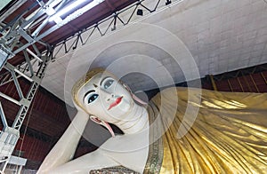 Big buddha Kyauk Htat Gyi reclining buddha statue in Myanmar Burma at night