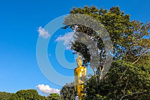 Big Buddha statue on a clear cloudless blue sky background