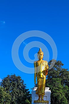 Big Buddha statue on a clear cloudless blue sky background