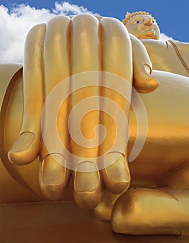big buddha statue hand and blue sky