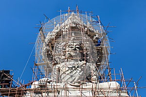 Big buddha statue under construction in thai temple
