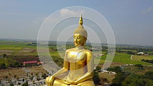 Big Buddha of Thailand, Aerial scene from sky Drone fly slide left