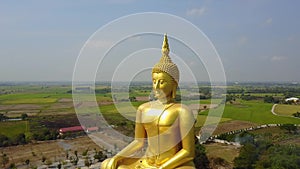 Big Buddha of Thailand, Aerial scene from sky Drone fly slide right