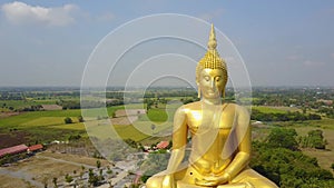 Big Buddha of Thailand, Aerial scene from sky Drone fly slide right