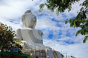 Big Buddha under construction with scaffolds in Phuket, Thailand