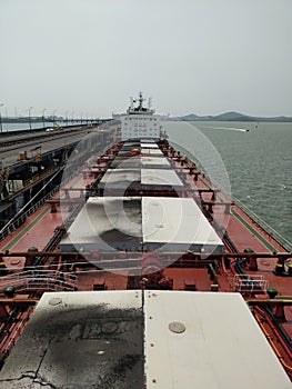 Big bulk carrier ship loading at the Gladstone port Australia