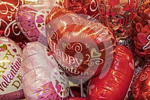 Big bunch of Valentine mylar heart shaped balloons with messages on them - taken from above photo