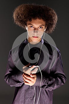 Big bushy afro hair teenager listening to music photo