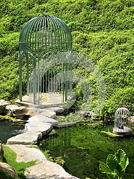 Big cage in a beautiful green garden