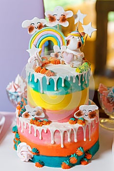 Big cake on the unicorn and rainbow theme. Sweets for children with fantasy style