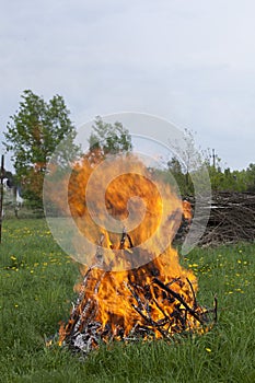 Big camp fire on the meadow