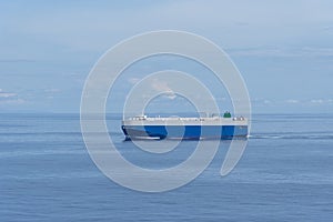 Big car carrier ship sailing through the Indian Ocean.