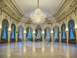 Big castle dancind room with candelabra in th middle. Castle interior. Empty room