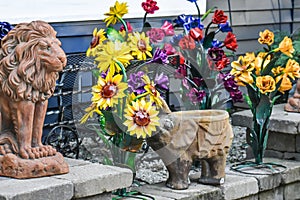 Big Cat Lion and Elephant Sculptures in Garden with Sunflowers
