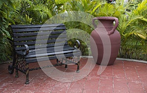 Big ceramic vase and banch on the terrace