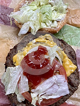 Big Cheeseburger With Lettuce, Tomato, Onion and Ketchup