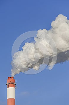 Big chimneys with dramatic clouds of smoke.