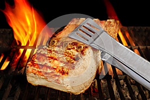 Big Chop Of Pork Ribs On The Flaming BBQ Grill