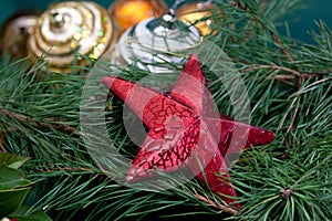 Big Christmas star ,baubles and fir branches