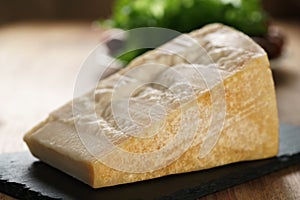 Big chunk of italian parmesan cheese on slate board