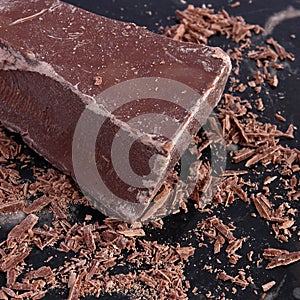 Big chunk of milk chocolate and shavings