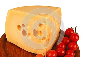 Big chunk of yellow cheese and tomatoes