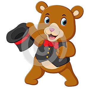 A big circus bear uses the best costume and holding his hat