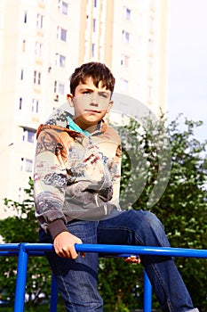 Big city boy in the yard playground