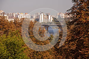 Big city far away with bridge flowing across a river. Walking on the city streets in summer. Tourists and travelling