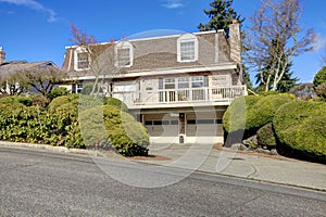 Big classic house with a balcony and arch windows