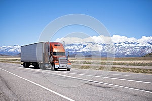 Big classic well maintained semi truck on high way