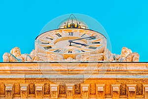 Big clock on building Bank of Spain Banco de Espana on Cibeles