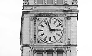 Big clock on a building on a street of Chicago Downtown