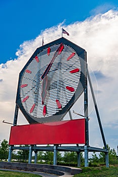 Big clock monument outdoor. Clock statue showing time. Structure of big clock