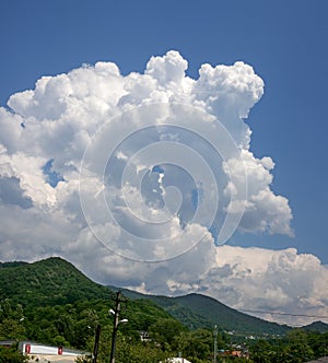 Big cloud above mountains