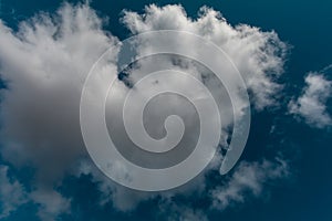 A big cloud in the blue sky.