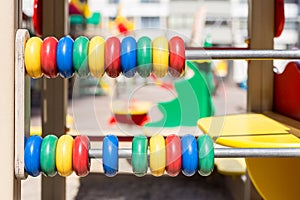 Big colorful abacus at oudoor children playground photo