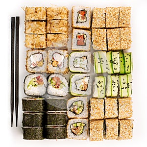 Big colorful sushi set on a white background. Top view.