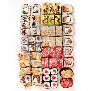 Big colorful sushi set on a white background. Top view.