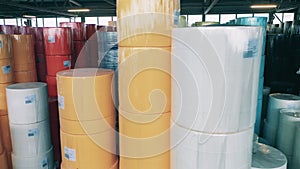 Big colourful paper rolls stored at a warehouse