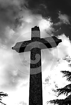 Big concrete cross with cloudscape above