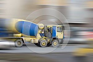 Big concrete mixer car rushing fast